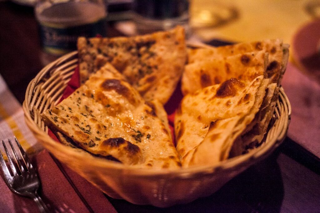 pexels photo 1117862 Close-up of traditional Indian flatbreads in a basket, perfect for a delicious meal.
