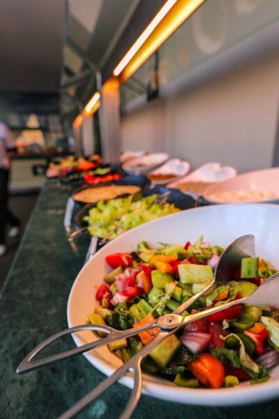 A colorful salad on a buffet table in a restaurant, emphasizing freshness and variety.